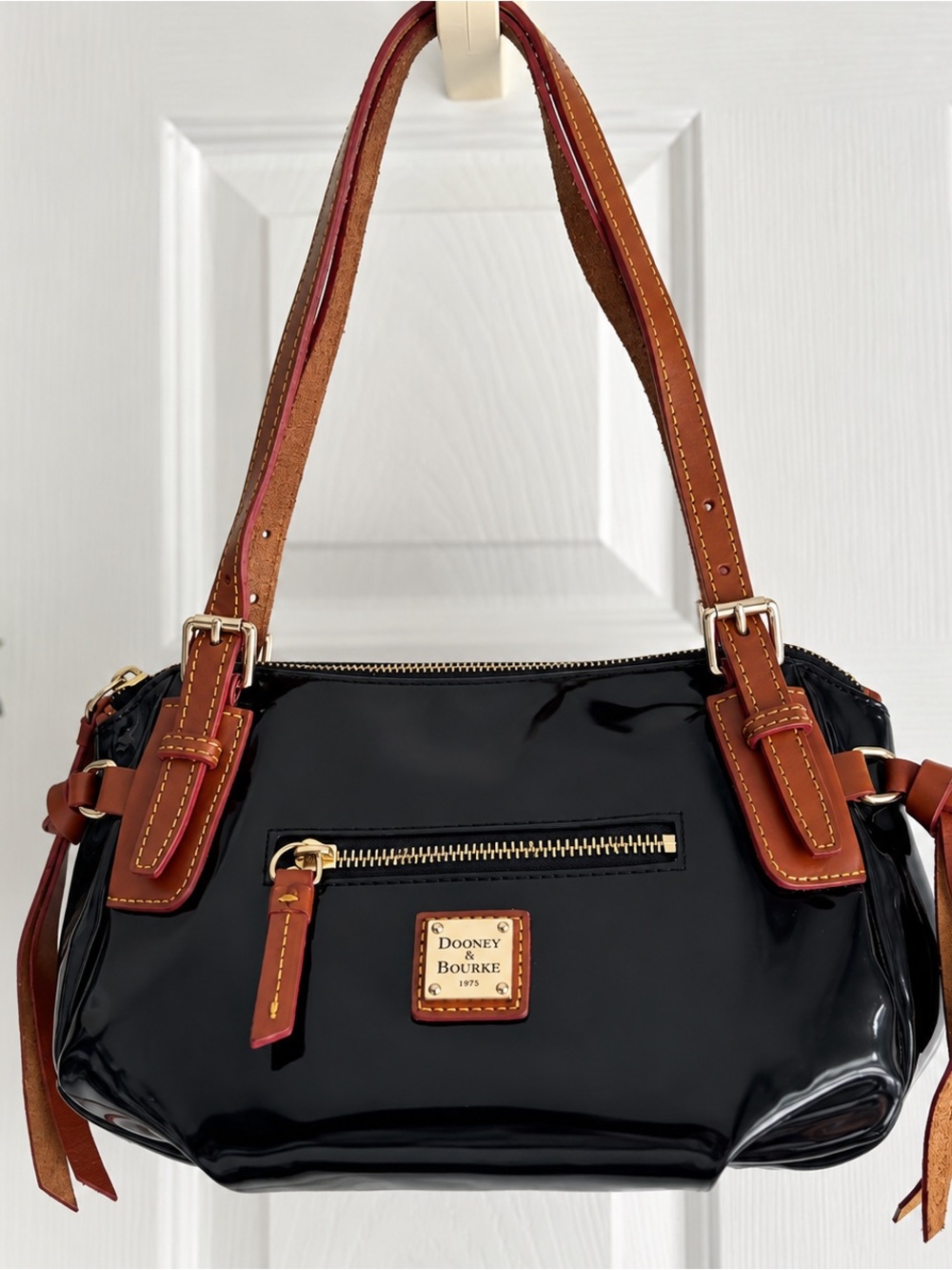 Dooney & Bourke Black Patent Shoulder Bag with Brown Trim and Gold Hardware
